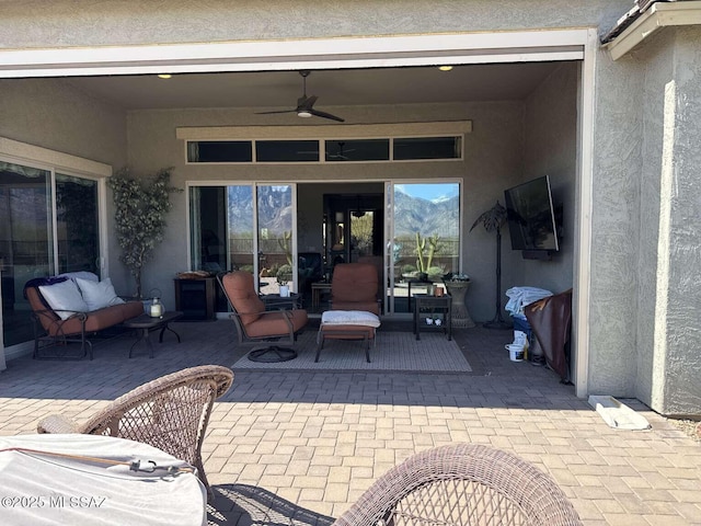 view of patio / terrace featuring ceiling fan