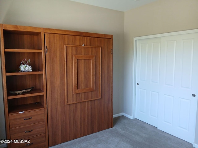 unfurnished bedroom with a closet and carpet