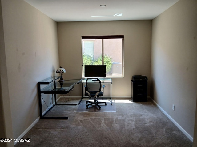 home office with baseboards and carpet floors