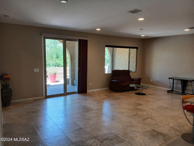 unfurnished room featuring recessed lighting, visible vents, and baseboards