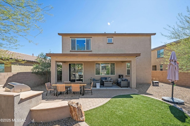 back of house featuring a patio area, an outdoor living space, a fenced backyard, and stucco siding