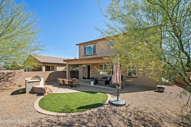 back of house with a patio, fence, an outdoor living space, and stucco siding