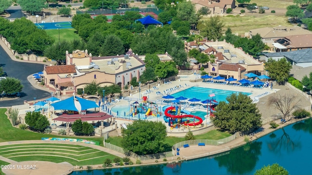 birds eye view of property with a residential view and a water view