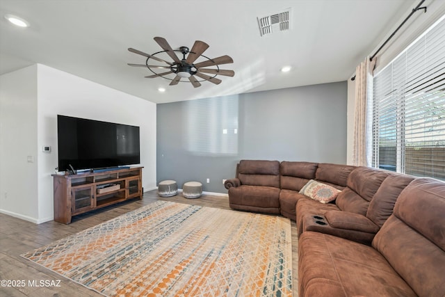 living room featuring recessed lighting, visible vents, wood finished floors, and ceiling fan