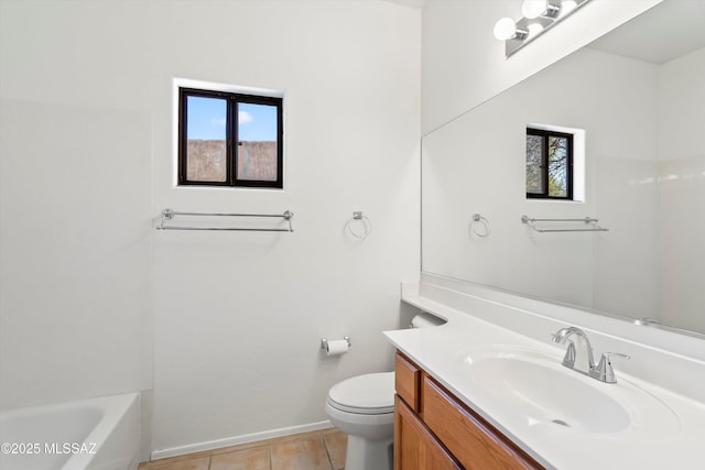 full bath with tile patterned flooring, baseboards, a washtub, toilet, and vanity