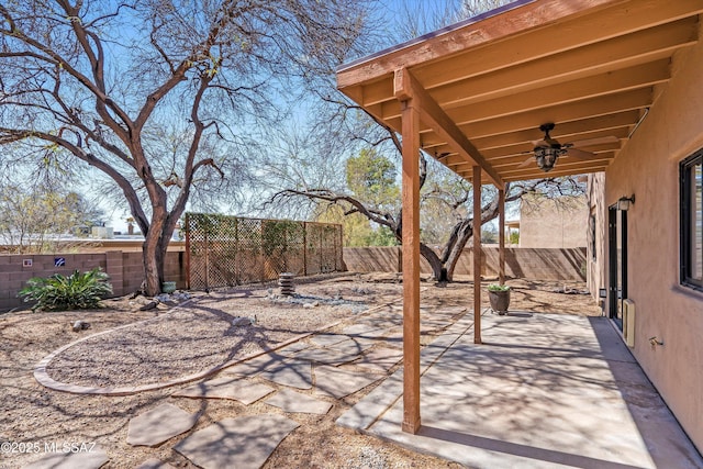 view of patio / terrace with a fenced backyard and ceiling fan