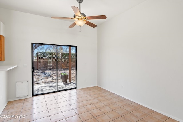 unfurnished room featuring light tile patterned floors and a ceiling fan