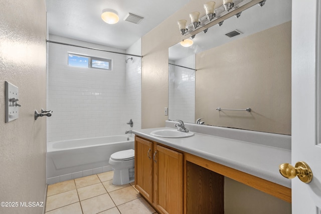 bathroom featuring vanity, tile patterned floors, toilet, and visible vents