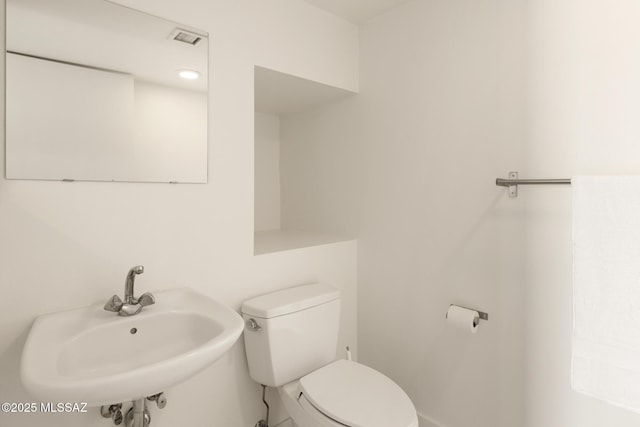 bathroom featuring a sink and toilet