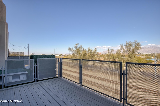 wooden terrace with a mountain view