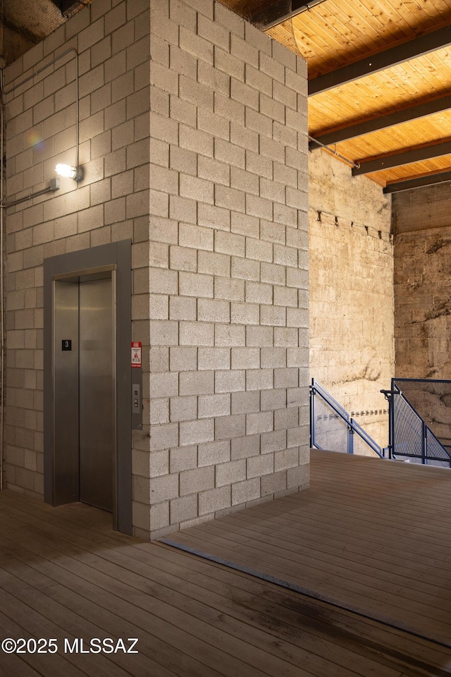 details with elevator and wood finished floors