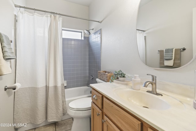 bathroom with vanity, tile patterned floors, toilet, and shower / tub combo with curtain