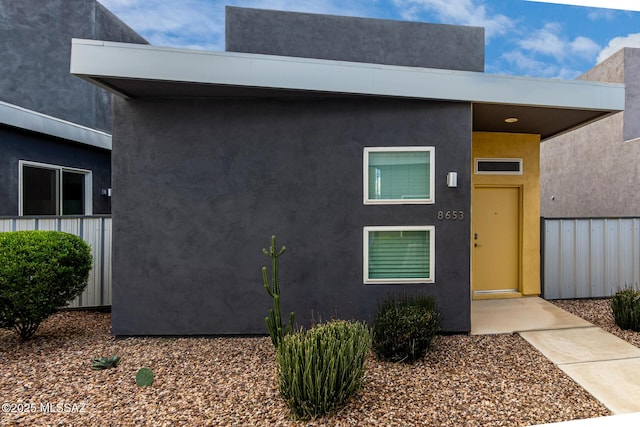 modern home featuring stucco siding