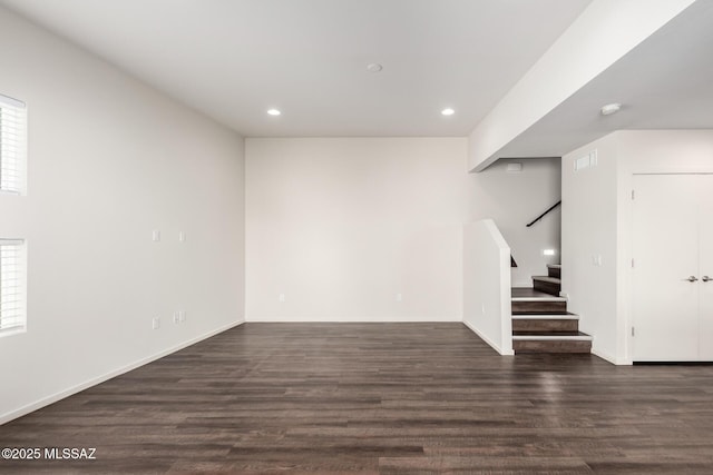 interior space featuring dark wood finished floors, stairway, recessed lighting, and visible vents