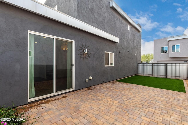 view of patio featuring fence