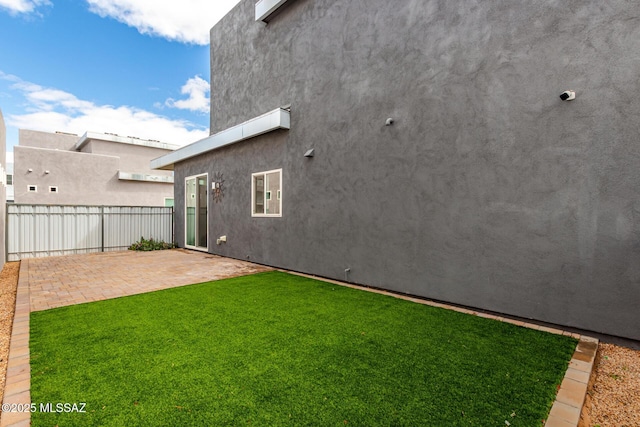 view of yard featuring a patio and fence