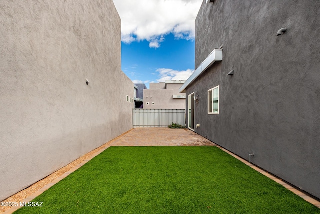 view of yard with a patio area and fence