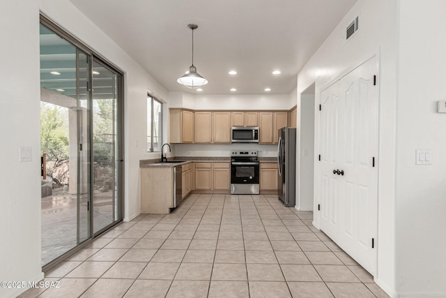 kitchen with visible vents, light brown cabinets, recessed lighting, stainless steel appliances, and a sink