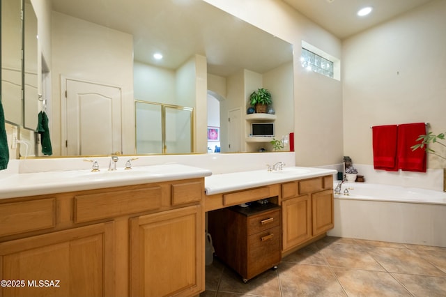 bathroom with tile patterned floors, a shower stall, vanity, and a bath