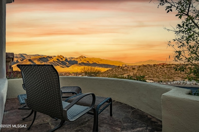 exterior space featuring a mountain view and a balcony