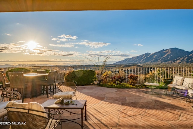 view of patio / terrace with outdoor lounge area and a mountain view