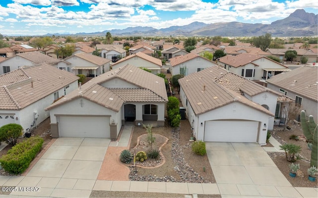 drone / aerial view featuring a mountain view and a residential view