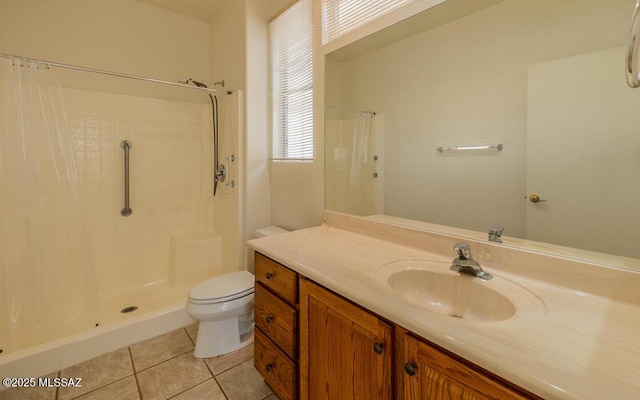 bathroom featuring vanity, tile patterned floors, toilet, and a shower with curtain