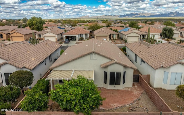 drone / aerial view with a mountain view and a residential view