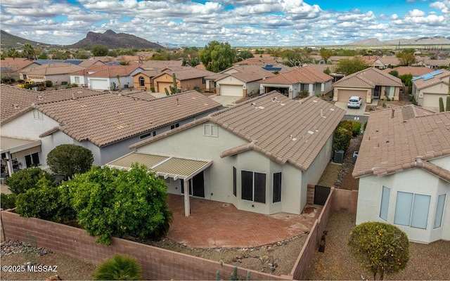 birds eye view of property featuring a mountain view and a residential view