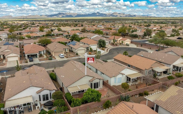 birds eye view of property with a mountain view and a residential view