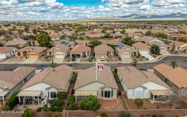 drone / aerial view featuring a mountain view and a residential view