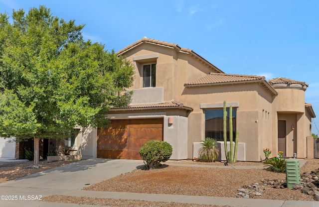 mediterranean / spanish house with stucco siding, an attached garage, driveway, and a tiled roof