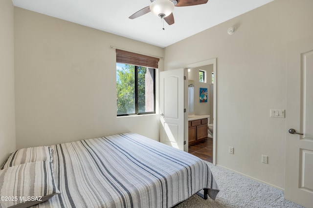 bedroom with connected bathroom and ceiling fan