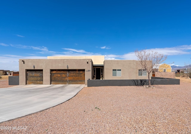 3337 E Wet Sand Pl, Vail, AZ 85641 - pueblo-style house with a garage, stucco siding, and concrete driveway