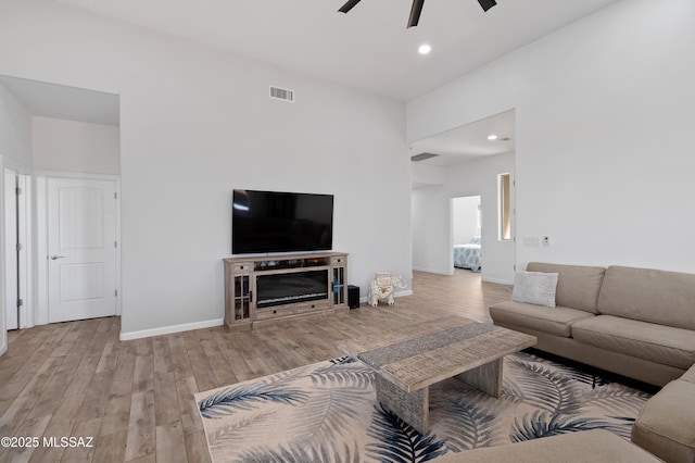 3337 E Wet Sand Pl, Vail, AZ 85641 - living area with ceiling fan, wood finished floors, recessed lighting, and baseboards