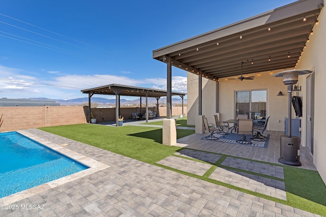 3337 E Wet Sand Pl, Vail, AZ 85641 - view of patio / terrace with ceiling fan, outdoor dining area, and a mountain view