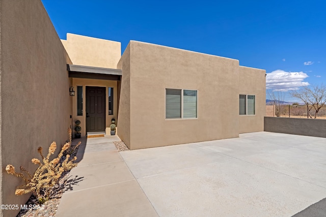 3337 E Wet Sand Pl, Vail, AZ 85641 - view of exterior entry featuring stucco siding and a patio area