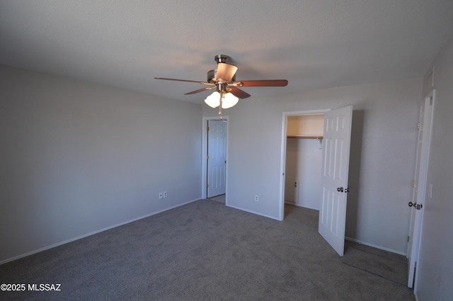 unfurnished bedroom featuring a ceiling fan, carpet, and baseboards