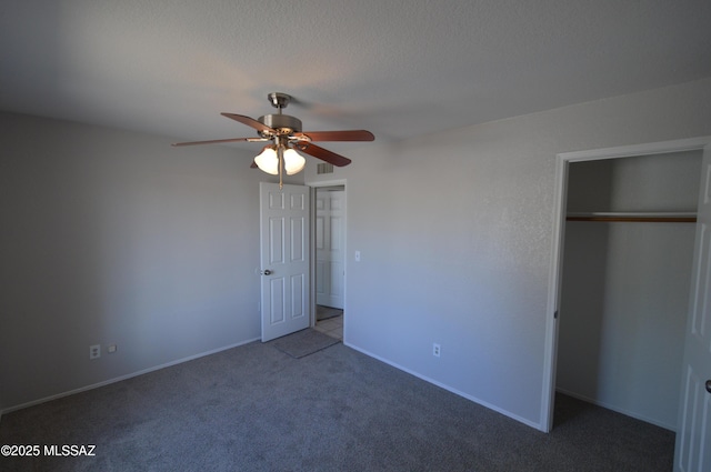 unfurnished bedroom featuring a closet, a textured ceiling, visible vents, carpet, and a ceiling fan