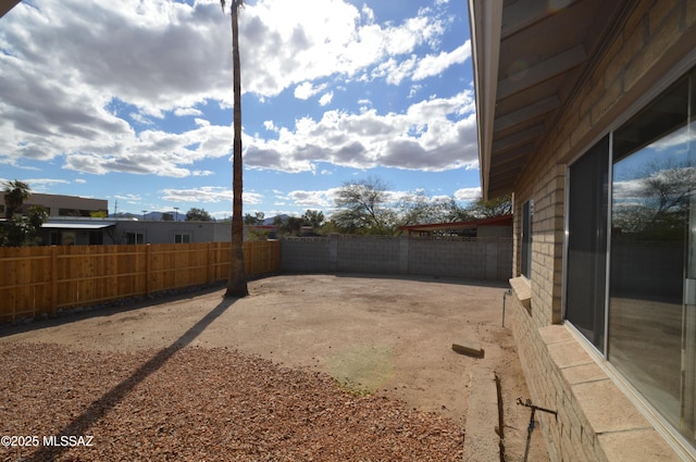 view of yard with a fenced backyard and a patio area