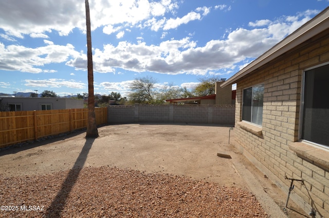 view of yard featuring a fenced backyard and a patio area
