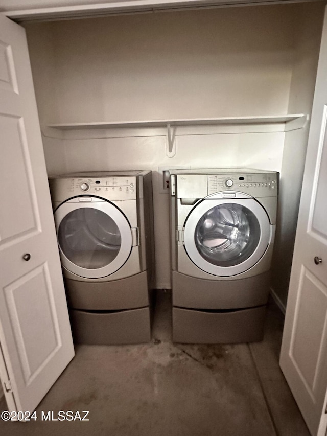 laundry area featuring washer and dryer and laundry area