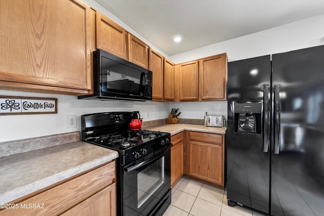 kitchen with black appliances, recessed lighting, brown cabinetry, light countertops, and light tile patterned floors