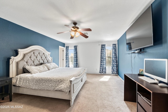 bedroom featuring a ceiling fan, light colored carpet, visible vents, and baseboards