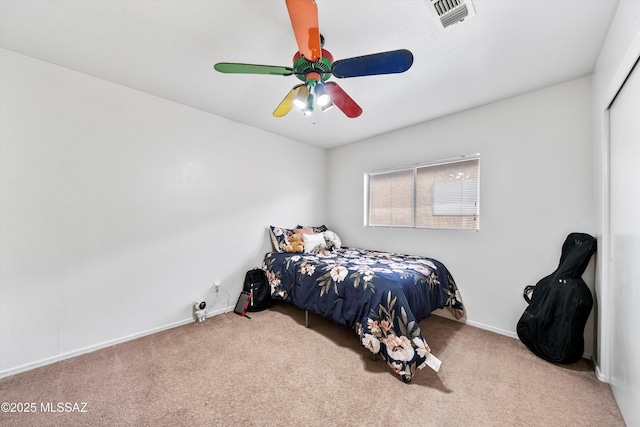 carpeted bedroom with baseboards, visible vents, and ceiling fan