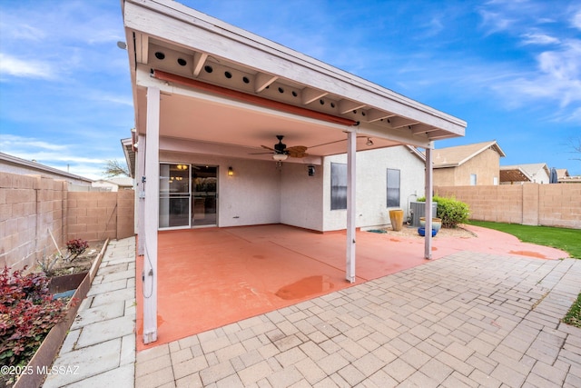 view of patio / terrace with a fenced backyard, central AC, and ceiling fan