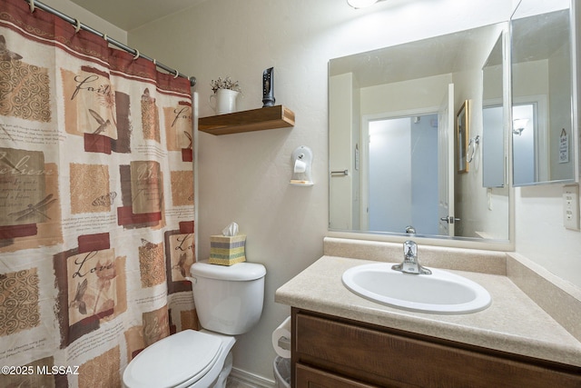 bathroom featuring a shower with curtain, toilet, and vanity