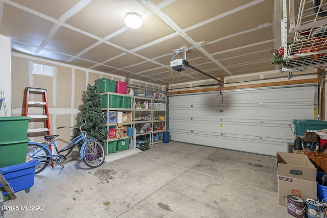 garage featuring a garage door opener