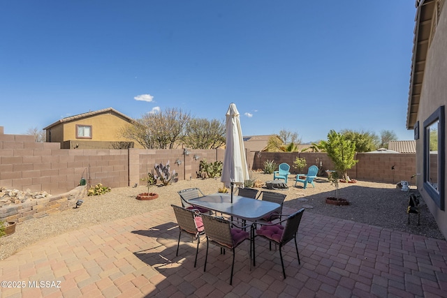 view of patio / terrace featuring a fenced backyard and outdoor dining space