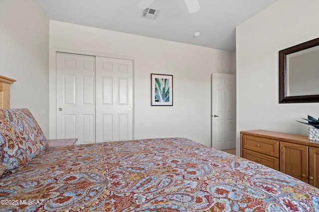 bedroom featuring a closet, visible vents, and ceiling fan